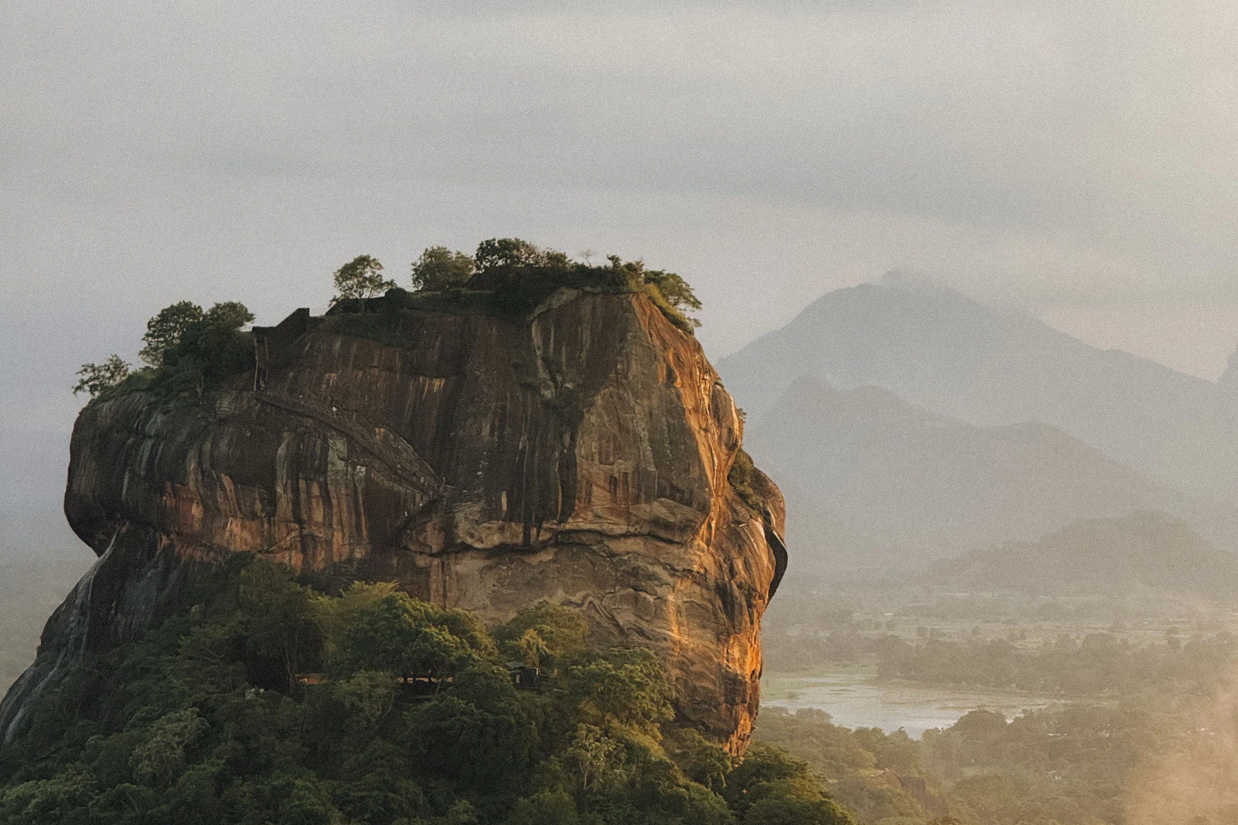 Aerial view of Sigiriya Rock Fortress rising above Sri Lanka's green landscape